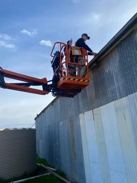 Commercial plumbing works using elevated work platform